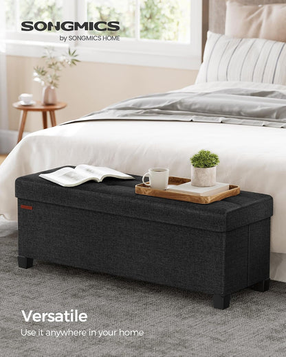 SONGMICS Storage Ottoman Bench, Foldable Foot Rest with Legs, 15 x 43 x 15.7 Inches, End of Bed Bench, Storage Chest, Load up to 660 lb, for Living Room, Bedroom, Entryway, Ink Black ULSF018B01